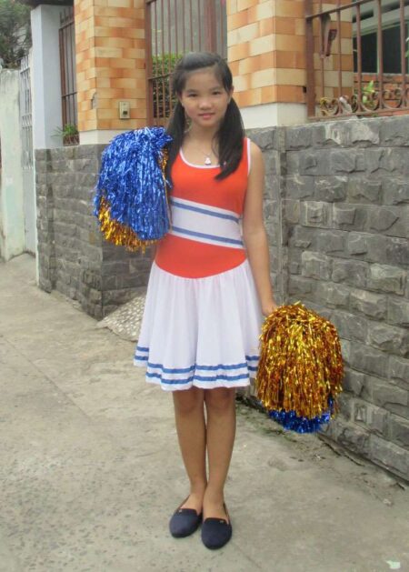 Váy múa cổ động trẻ em cam phối trắng